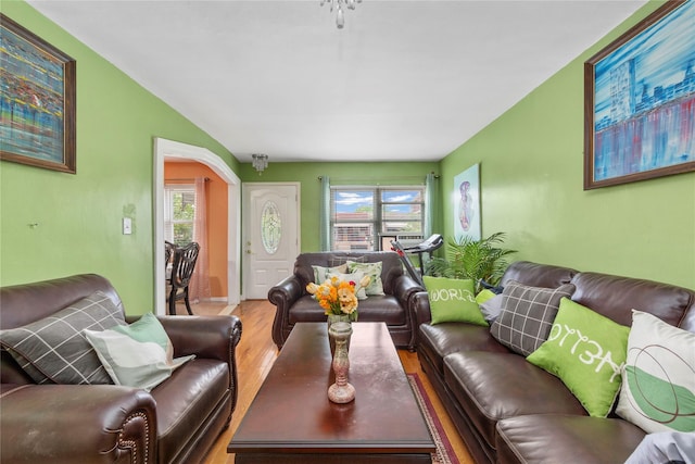 1157 E 102nd St, Brooklyn, NY 11236 - living area with wood finished floors, plenty of natural light, and arched walkways
