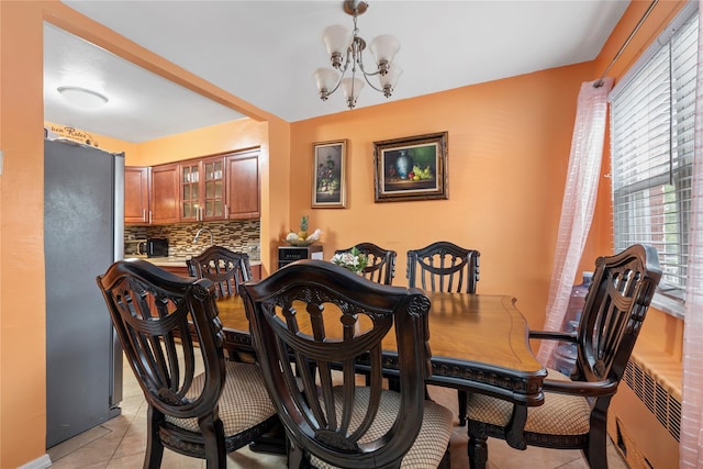 1157 E 102nd St, Brooklyn, NY 11236 - dining area with a chandelier and light tile patterned flooring