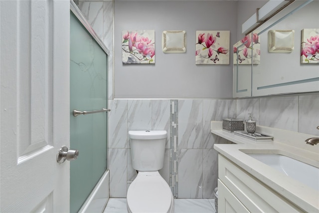 1157 E 102nd St, Brooklyn, NY 11236 - full bathroom with vanity, tile walls, bath / shower combo with glass door, and a wainscoted wall