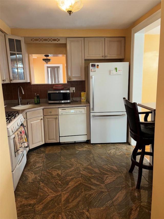 92 Norfeld Blvd, Elmont, NY 11003 - kitchen with white appliances, decorative backsplash, glass insert cabinets, and light countertops