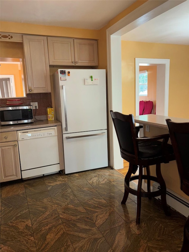 92 Norfeld Blvd, Elmont, NY 11003 - kitchen with white appliances, backsplash, and light countertops