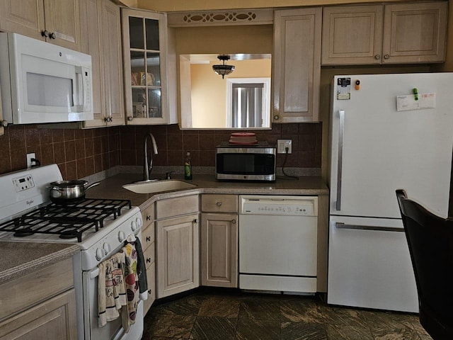 92 Norfeld Blvd, Elmont, NY 11003 - kitchen with white appliances, tasteful backsplash, glass insert cabinets, and dark countertops
