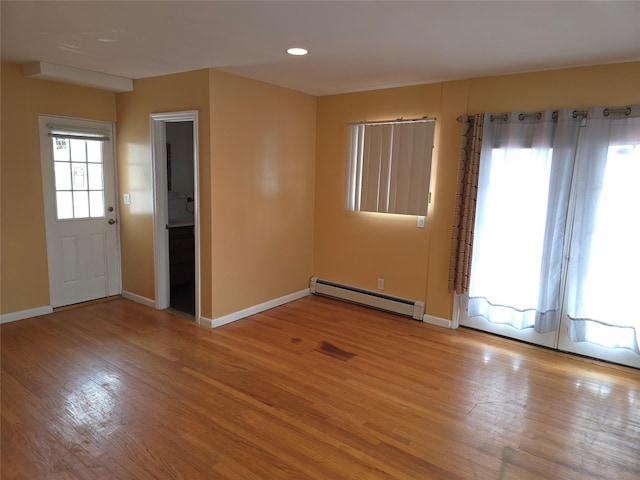 92 Norfeld Blvd, Elmont, NY 11003 - spare room featuring baseboard heating, light wood finished floors, and recessed lighting