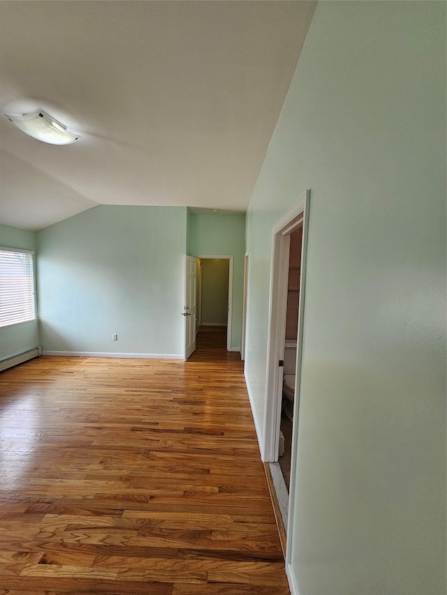 92 Norfeld Blvd, Elmont, NY 11003 - spare room with lofted ceiling and wood finished floors