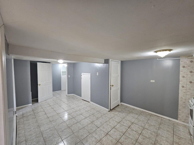 92 Norfeld Blvd, Elmont, NY 11003 - empty room featuring baseboards and light tile patterned floors