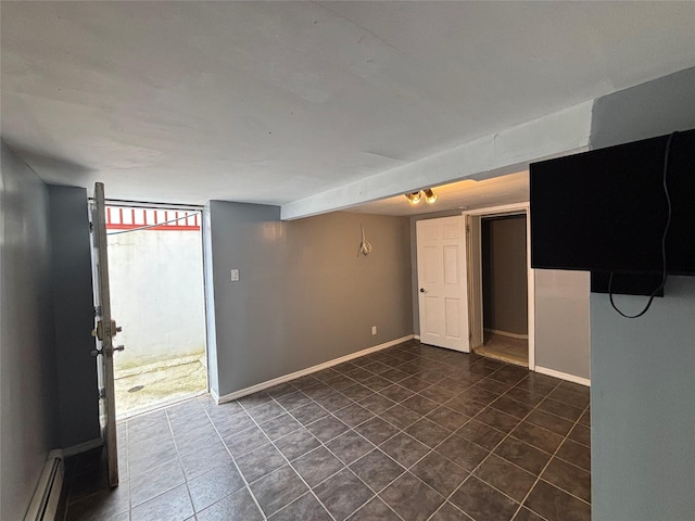 92 Norfeld Blvd, Elmont, NY 11003 - unfurnished room with baseboard heating and dark tile patterned floors