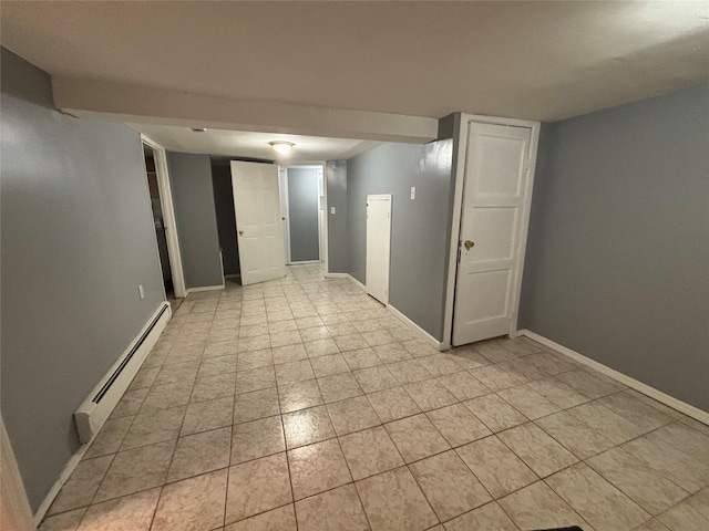 92 Norfeld Blvd, Elmont, NY 11003 - empty room featuring a baseboard heating unit and light tile patterned floors