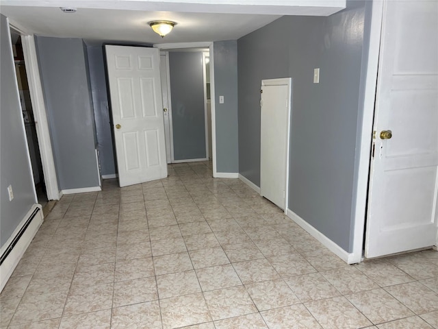 92 Norfeld Blvd, Elmont, NY 11003 - unfurnished room featuring a baseboard radiator and baseboards