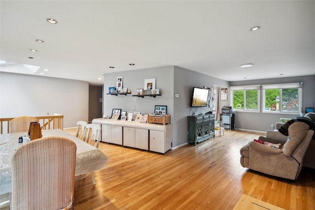 11 Robin Ln, Plainview, NY 11803 - living area featuring light wood-type flooring, a skylight, and recessed lighting