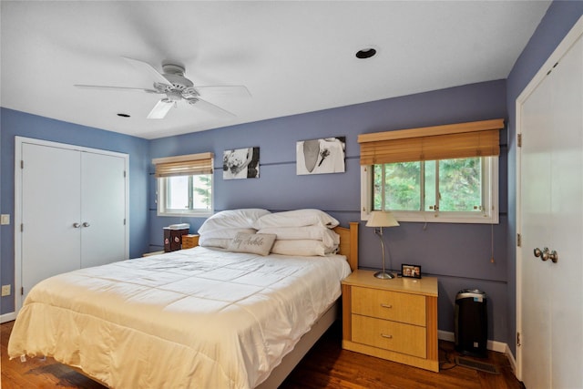 11 Robin Ln, Plainview, NY 11803 - bedroom featuring a closet, dark wood-style flooring, and a ceiling fan