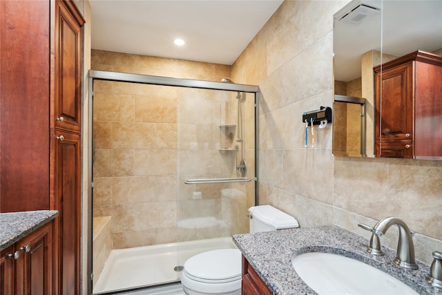 11 Robin Ln, Plainview, NY 11803 - bathroom with tile walls, vanity, a shower stall, and decorative backsplash