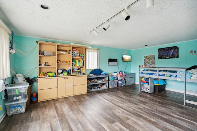 11 Robin Ln, Plainview, NY 11803 - game room featuring track lighting, a textured ceiling, and wood finished floors