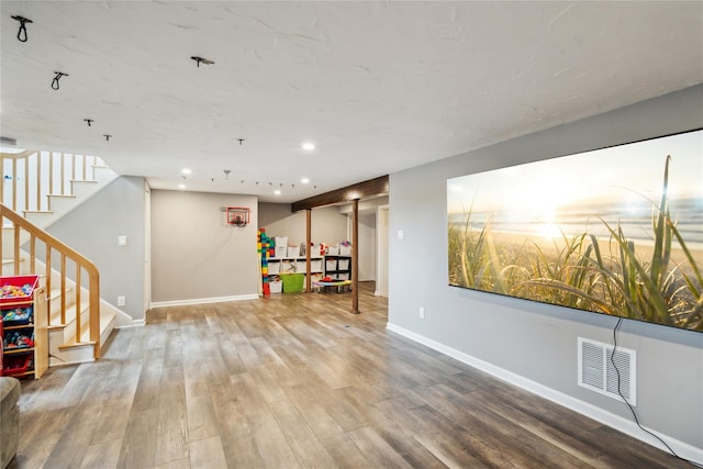 11 Robin Ln, Plainview, NY 11803 - recreation room with wood finished floors and recessed lighting