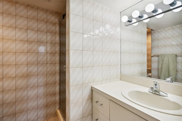 11 Robin Ln, Plainview, NY 11803 - bathroom with a stall shower, vanity, and tile walls