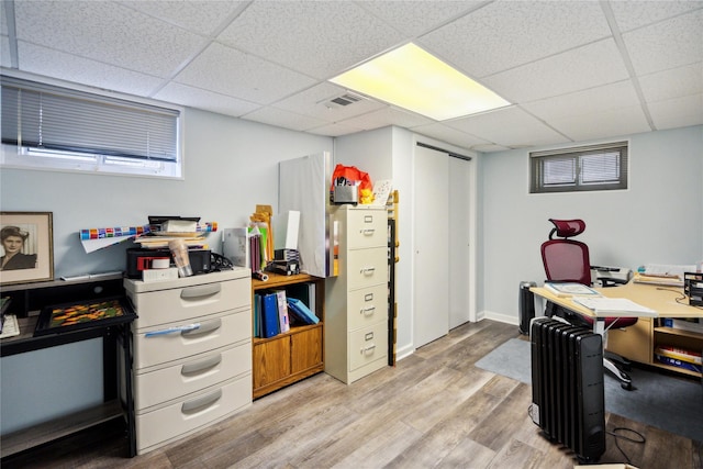 11 Robin Ln, Plainview, NY 11803 - office area with a paneled ceiling and light wood-style flooring