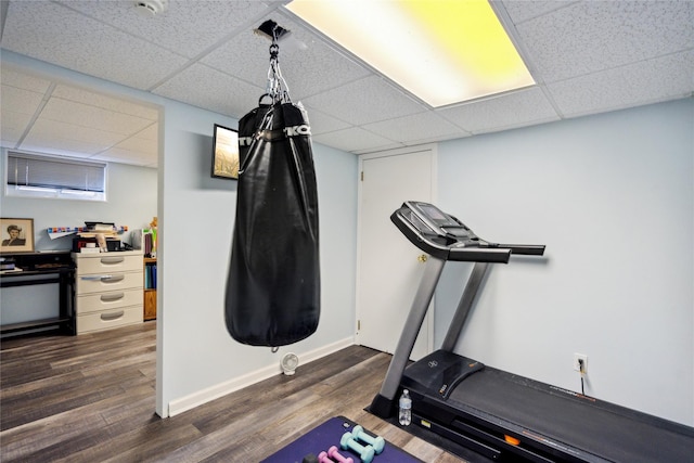 11 Robin Ln, Plainview, NY 11803 - exercise area featuring a paneled ceiling and dark wood-type flooring