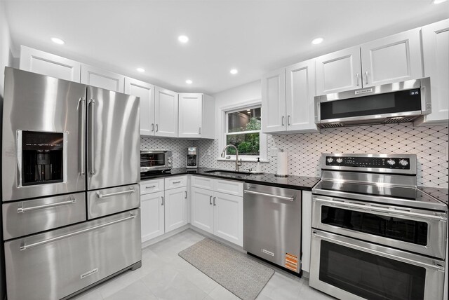 12 Valley Ln, Garrison, NY 10524 - kitchen featuring stainless steel appliances, white cabinets, tasteful backsplash, and recessed lighting