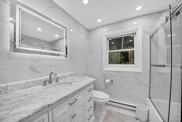 12 Valley Ln, Garrison, NY 10524 - full bath featuring a baseboard heating unit, vanity, a combined bath / shower with marble appearance, tile walls, and marble finish floors