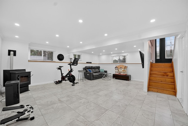 12 Valley Ln, Garrison, NY 10524 - exercise room featuring recessed lighting, light marble finish floors, healthy amount of natural light, a wood stove, and ornamental molding