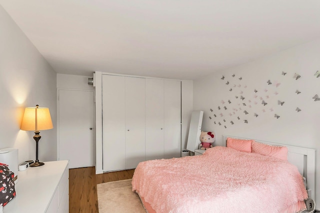 2 Bay Clb Unit 11F, Bayside, NY 11360 - bedroom featuring light wood-style floors and a closet