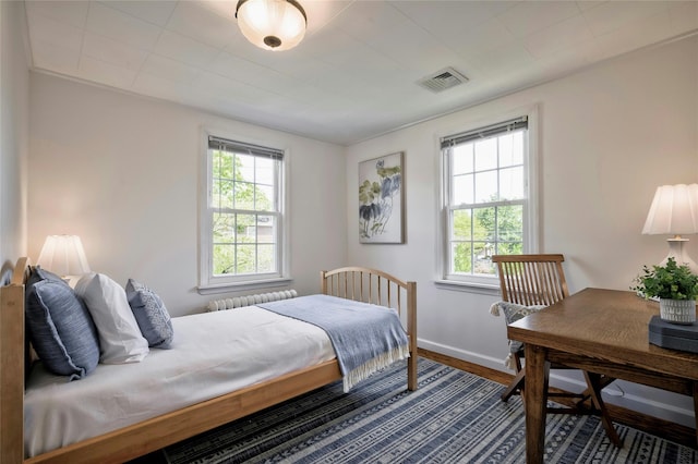 10 Cross St, Port Washington, NY 11050 - bedroom with radiator and wood finished floors