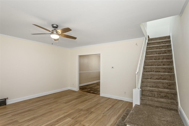 6739 Cooper Ave, Glendale, NY 11385 - staircase featuring a ceiling fan, wood finished floors, and ornamental molding