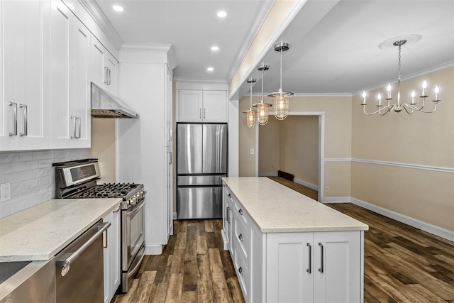6739 Cooper Ave, Glendale, NY 11385 - kitchen with stainless steel appliances, under cabinet range hood, a chandelier, dark wood-type flooring, and tasteful backsplash