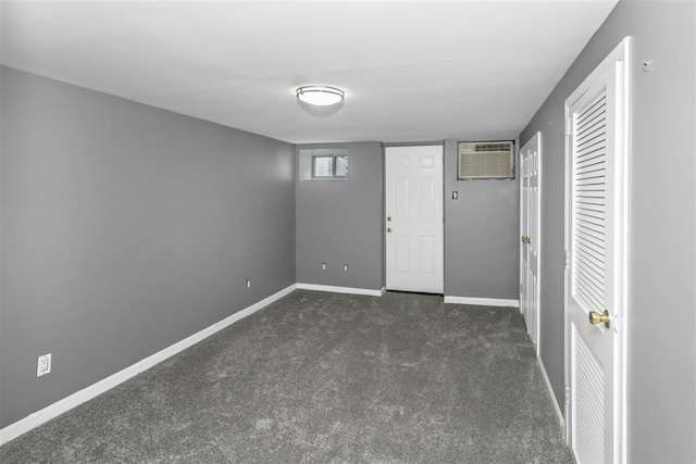 6739 Cooper Ave, Glendale, NY 11385 - unfurnished bedroom with a wall mounted AC and dark colored carpet