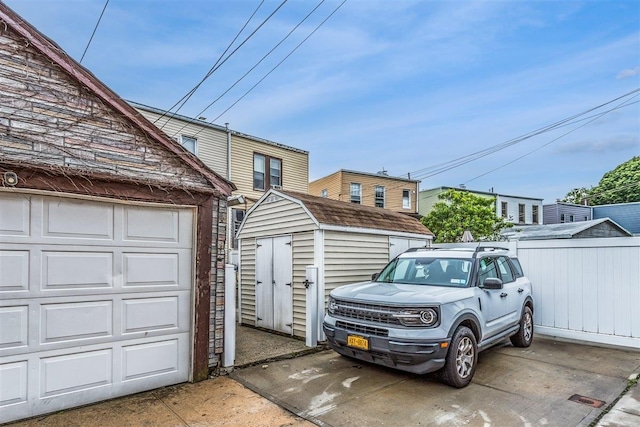 6739 Cooper Ave, Glendale, NY 11385 - garage featuring a storage shed