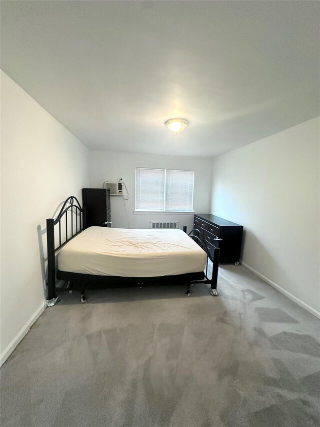 67-62 150th St Unit 426A, Flushing, NY 11367 - bedroom featuring carpet and a wall mounted AC