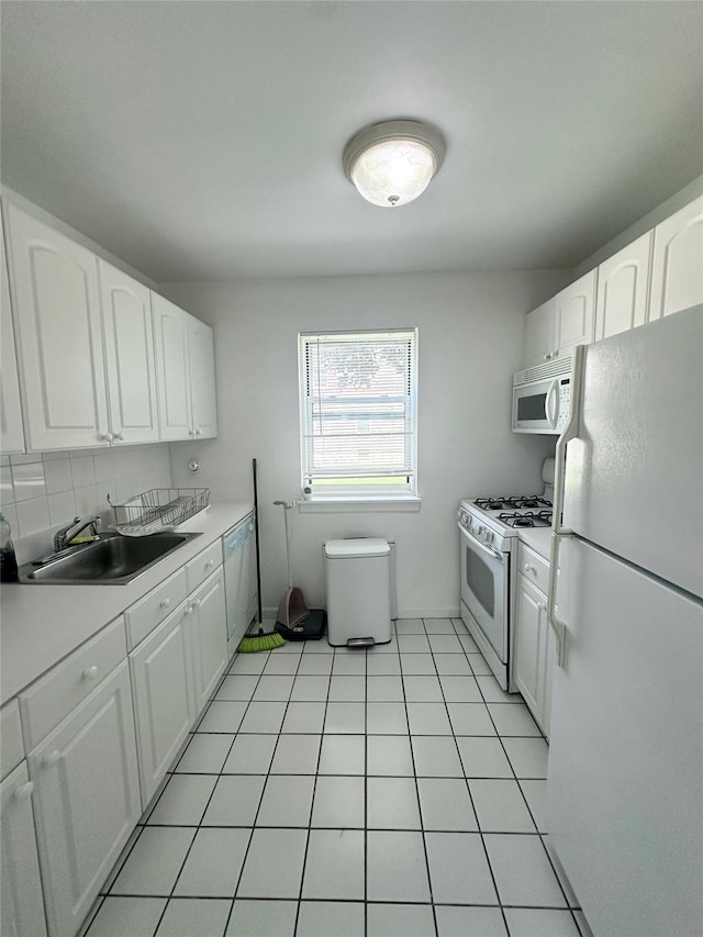 67-62 150th St Unit 426A, Flushing, NY 11367 - kitchen featuring white appliances, white cabinetry, and light countertops