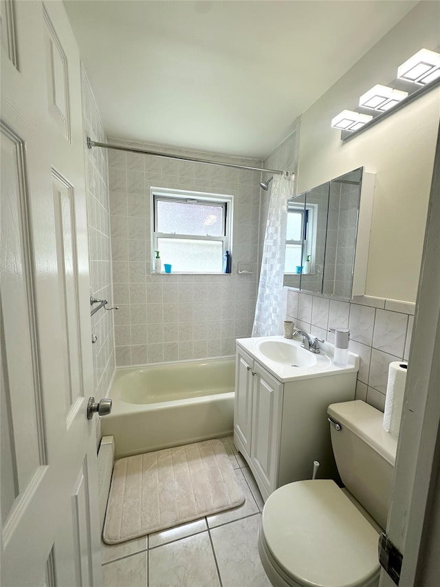 67-62 150th St Unit 426A, Flushing, NY 11367 - bathroom featuring tile walls, shower / bath combination with curtain, vanity, and tile patterned floors