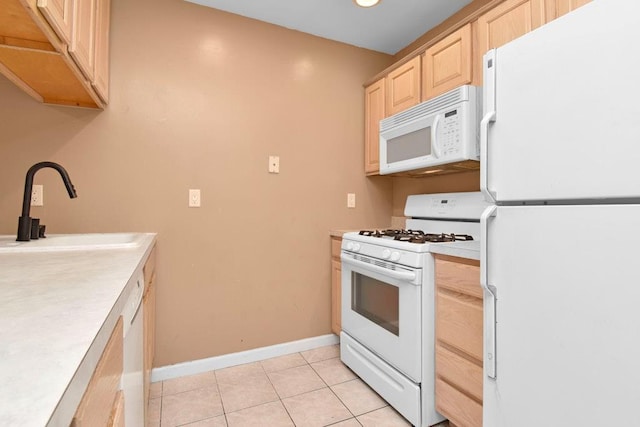 200 Davis Ave Unit 3C, Bronx, NY 10465 - kitchen featuring white appliances, light brown cabinets, light countertops, and light tile patterned flooring