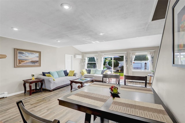 50 Apollo Ln, Hicksville, NY 11801 - living area featuring wood finished floors, vaulted ceiling, recessed lighting, and a wall mounted air conditioner