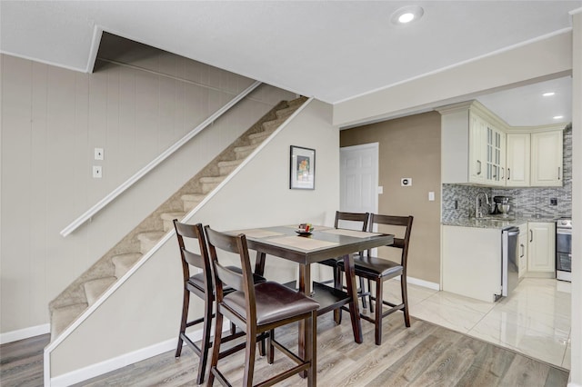 50 Apollo Ln, Hicksville, NY 11801 - dining area with stairway, light wood-type flooring, and recessed lighting