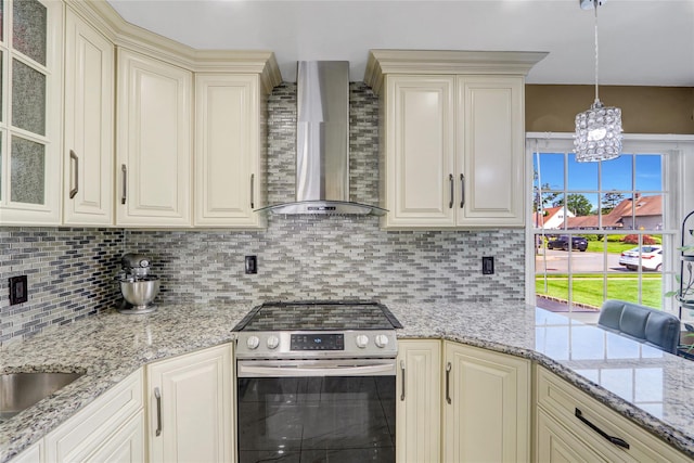 50 Apollo Ln, Hicksville, NY 11801 - kitchen featuring stainless steel electric stove, wall chimney exhaust hood, cream cabinetry, tasteful backsplash, and glass insert cabinets