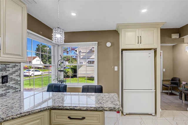 50 Apollo Ln, Hicksville, NY 11801 - kitchen with freestanding refrigerator, cream cabinets, decorative backsplash, and recessed lighting