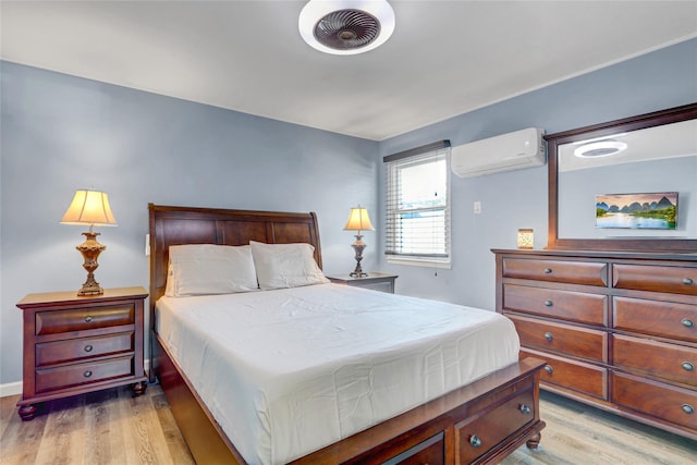 50 Apollo Ln, Hicksville, NY 11801 - bedroom featuring a wall mounted air conditioner and light wood-type flooring
