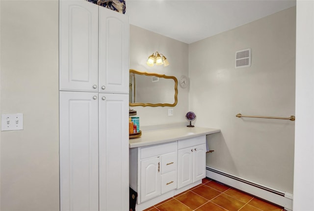 50 Apollo Ln, Hicksville, NY 11801 - bathroom with baseboard heating, vanity, and tile patterned flooring