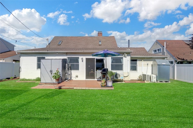50 Apollo Ln, Hicksville, NY 11801 - back of property with a fenced backyard, a wooden deck, a chimney, and roof with shingles