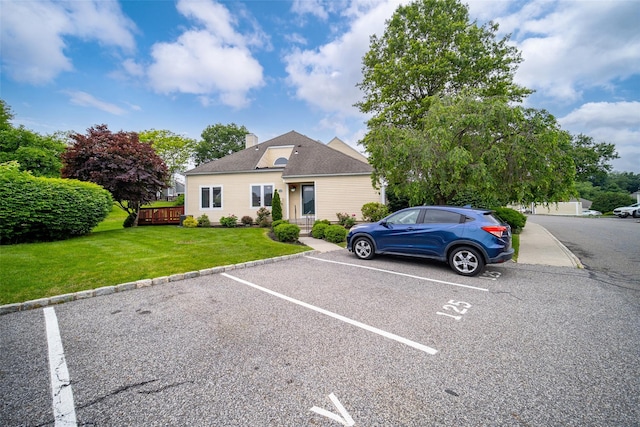 125 Fairways Cres, Carmel, NY 10512 - view of front of property featuring uncovered parking, a chimney, and a front lawn