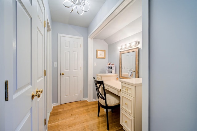 125 Fairways Cres, Carmel, NY 10512 - office with light wood-type flooring, a chandelier, and built in desk