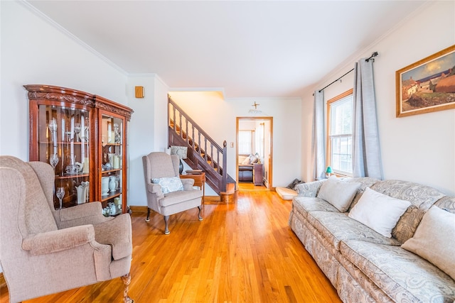5023 213th St, Bayside, NY 11364 - living area with stairs, light wood finished floors, and crown molding