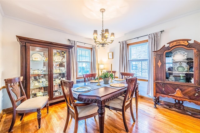 5023 213th St, Bayside, NY 11364 - dining area featuring a chandelier, light wood-style flooring, and crown molding