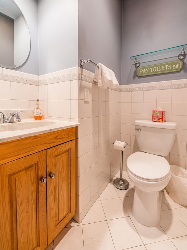 5023 213th St, Bayside, NY 11364 - bathroom with tile walls, vanity, tile patterned floors, and a wainscoted wall