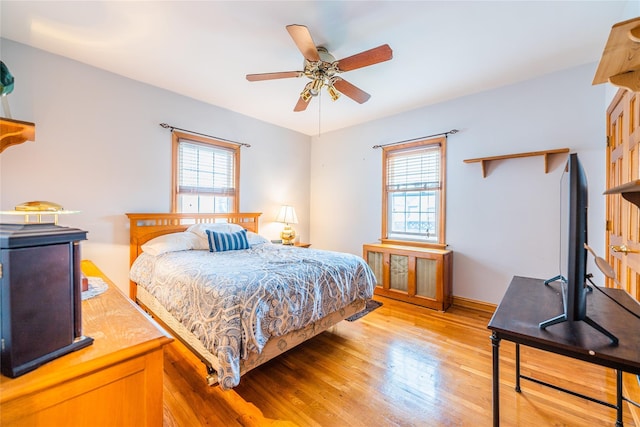 5023 213th St, Bayside, NY 11364 - bedroom with multiple windows, light wood-style flooring, and ceiling fan