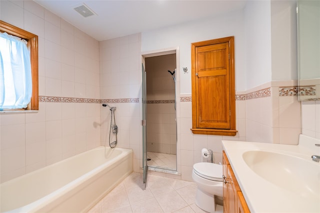 5023 213th St, Bayside, NY 11364 - full bath with tile walls, vanity, a bath, a stall shower, and tile patterned floors