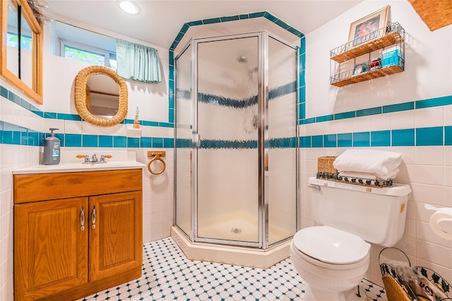 5023 213th St, Bayside, NY 11364 - bathroom featuring tile walls, vanity, a stall shower, and recessed lighting