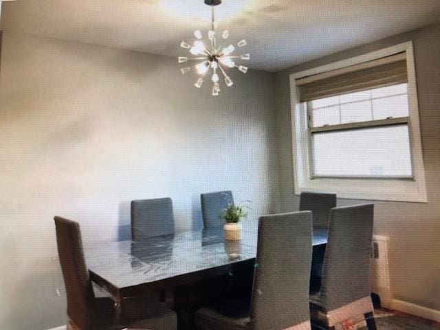 249-29 64th Ave Unit 2, Little Neck, NY 11362 - dining space with a chandelier and baseboards