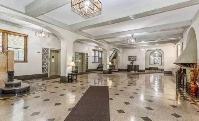 35-21 81st St Unit 1B, Jackson Heights, NY 11372 - common area with stairway and beam ceiling